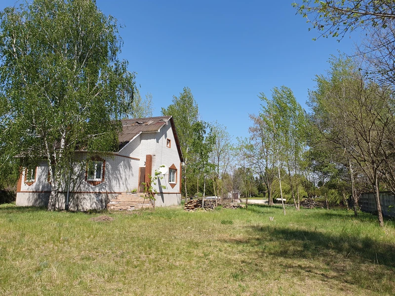 Продаж земельної ділянки біля води з будинком — фото 2 з 4
